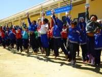 School children waving